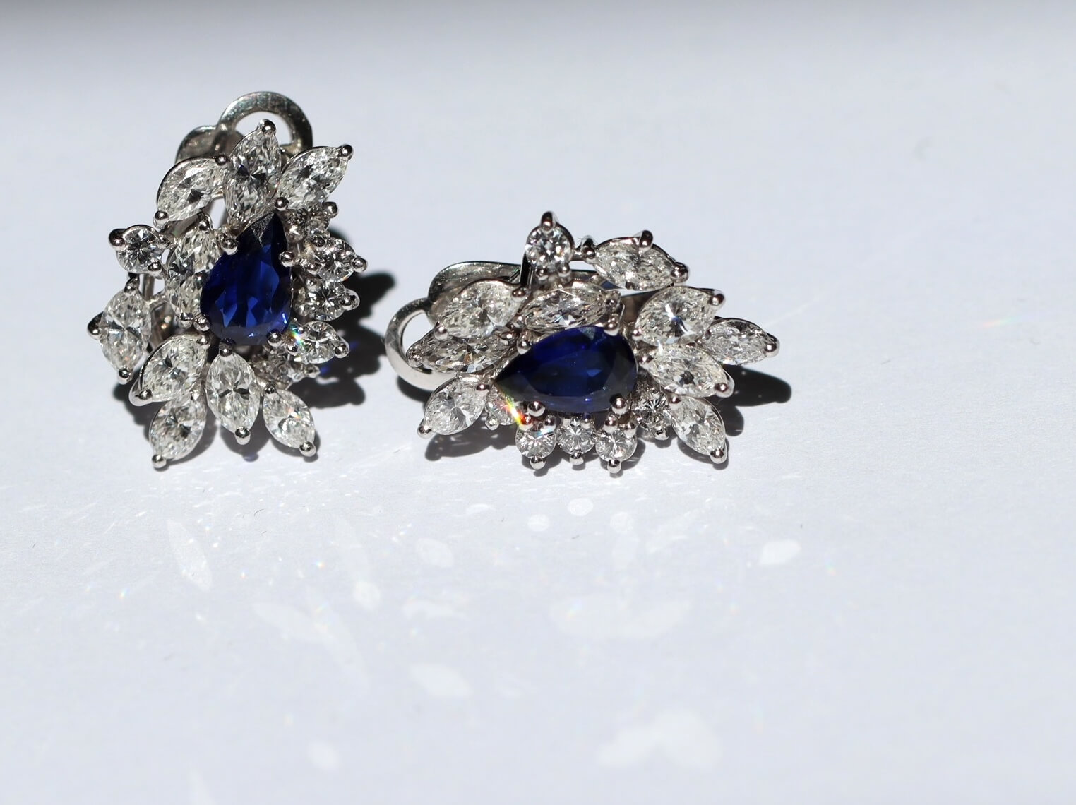 A Pair of Sapphire and Diamond Cluster Earrings