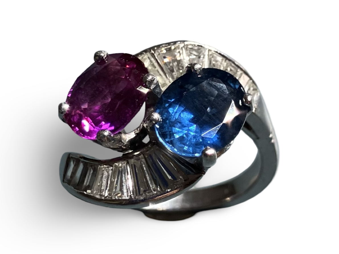 A Pre-Owned Blue and Pink Sapphire and Diamond Crossover Ring