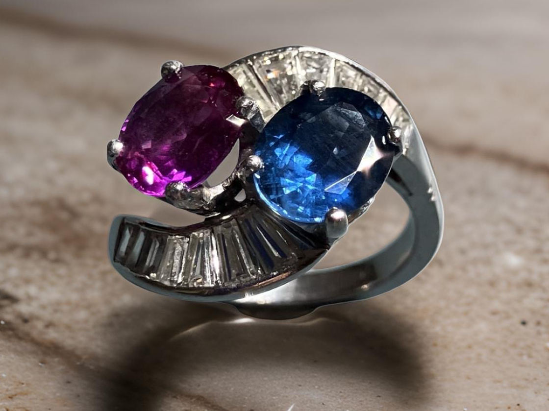 A Pre-Owned Blue and Pink Sapphire and Diamond Crossover Ring